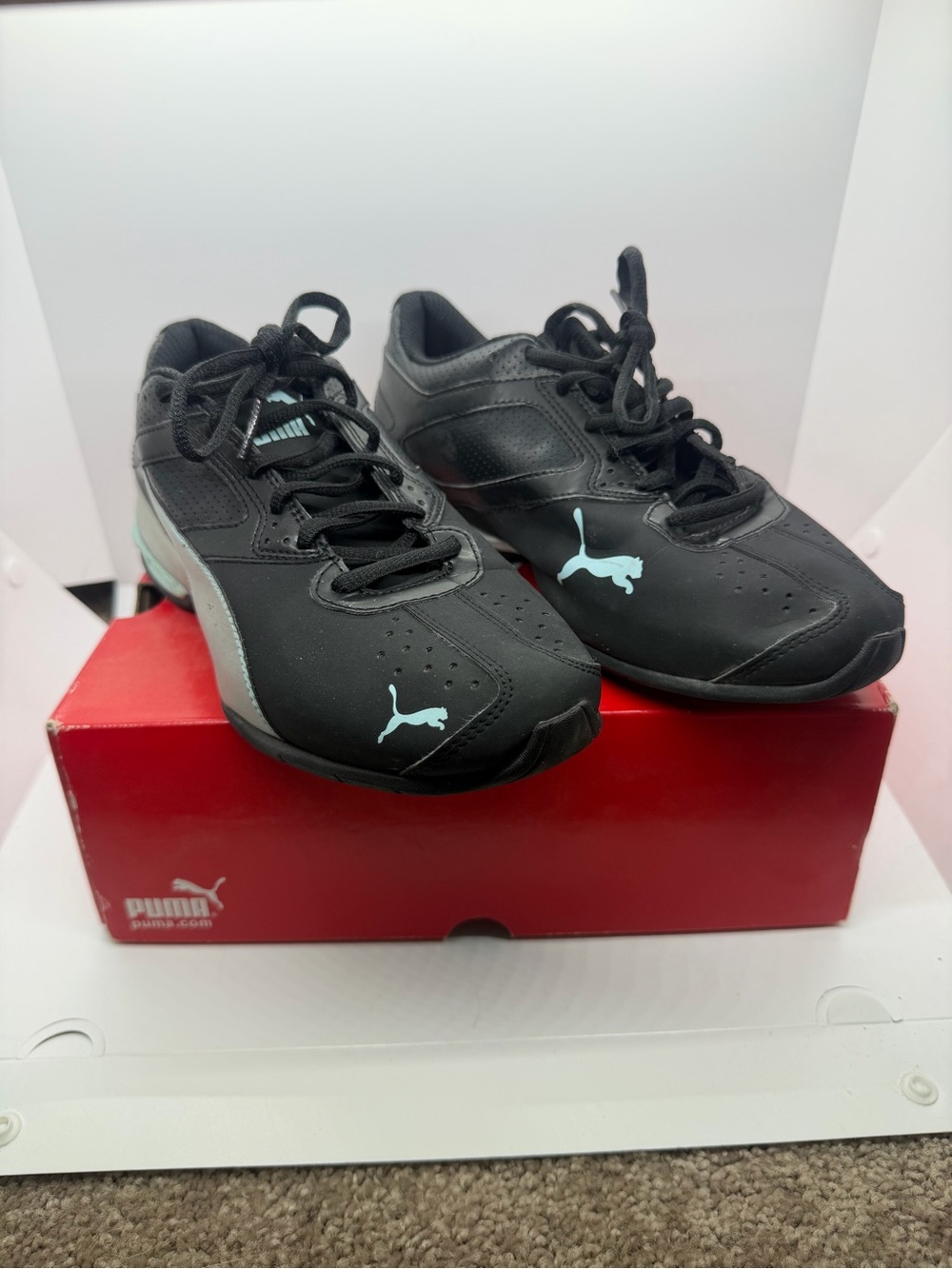 Puma Women’s Black Sneakers with Light Blue Logos